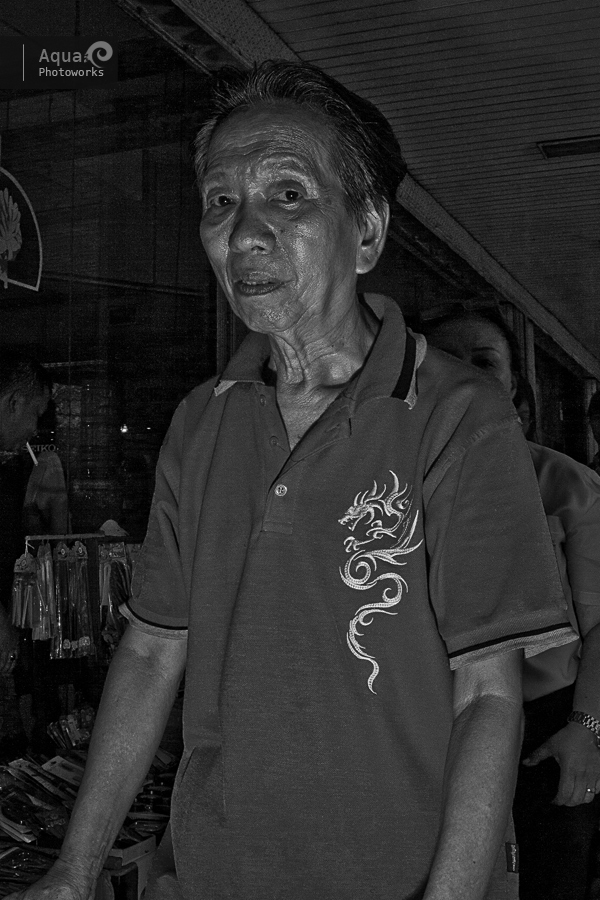 Old Man With Dragon Sign